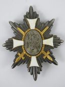 A WWI German Deutsches Feld-EhrenZeichen badge having white enamel cross to front,