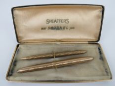 A Sheaffer's 'new snorkel pen set' in box being fountain pen and propelling pencil, slightly a/f.