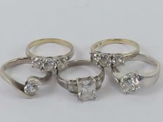 Five silver rings set with white stones sizes M-O, each stamped 925.
