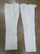 Two pairs of white sporting trousers; Ken Barrington 34 waist 31 leg, and Bukta.