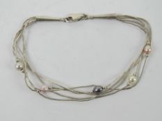 A sterling silver and coloured pearl bracelet having Native American Pictomark upon (unknown