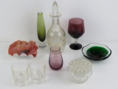 A cut glass decanter with stopper together with an overlaid glass frilled dish,