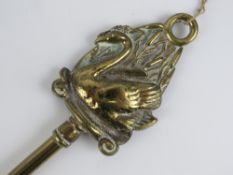 A brass shoe horn having decorative Swan shaped finial, 50.5cm in length.