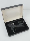 A 'Screwpull' lever corkscrew, in box with foil cutter, box a/f.