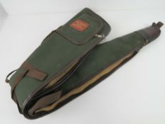 A fleece-lined canvas gun slip by Four Counties Sports Newbury, zip a/f.