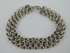 A heavy HM silver three row chain bracelet, hallmarked for London, 18.5cm in length, 23g.