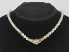 Vintage Christian Dior; a faux pearl necklace measuring approx 40cm in length, marked Chr.