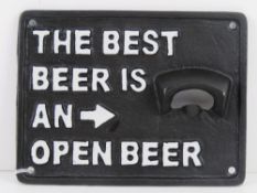 A contemporary cast metal 'the best beer is an open beer' sign, 17 x 12.5cm.