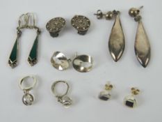 Six pairs of silver earrings including; green Art Deco style enamelled drops, Viking ship clip-on,