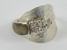 A silver ring formed from a salt spoon having hardstone cabachon upon, size W-X.