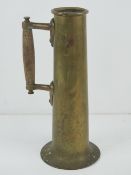 Trench Art; a brass shell casing converted for use as a handle jug or vase, 30cm high.