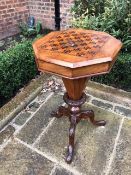 A Victorian chequer-top sewing table in walnut and mahogany.