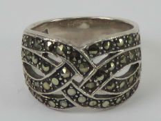 A silver and marcasite ring having four rows of 'woven' marcaties, graduated band measuring 1.