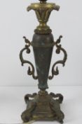 A brass table lamp in the form of an urn on plinth, standing 34cm high.