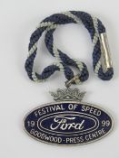 A Festival of Speed Goodwood press centre medallion in blue enamel for Ford 1999.