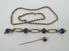 Three antique pieces of jewellery including a German rolled gold bracelet section set with blue