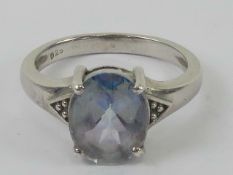 A silver and Topaz ring (light mystic colouring mostly purple/blue with a green flash),
