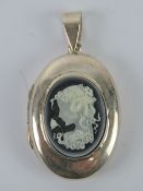 A large silver locket having black and white cameo portrait of a female with flower, stampe d925, 4,