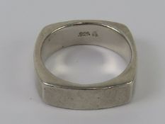 A HM silver ring of unusual square form, plain heavy band, hallmarked for Sheffield, size O-P, 8.1g.