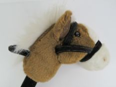 Musical Hobby Horse; a fine Chestnut Hunter with white mane, cloth bridle, measuring two hands,