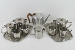 A Picquot water tea pot, together with two stainless steel tea services with trays.