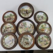 A collection of 'Life on the Farm' decorative plates in frames,