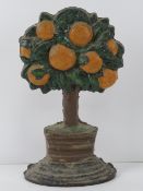 A heavy cast iron contemporary door stop in the form of an orange tree, 28cm high.