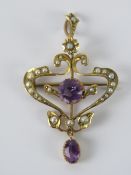 An Art Nouveau amethyst and seed pearl brooch/pendant,