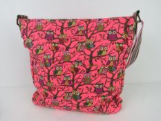 A fabric tote bag having owl pattern in