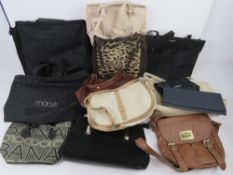 A quantity of assorted handbags.