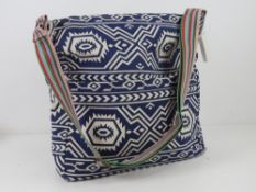 A fabric navy blue Aztec pattern tote ba