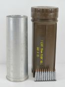 A British 88mm blank shell case with transit case together with a clip of ten 5.56 training rounds.
