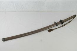 A WWII Japanese Gunto Sword, clean blade and with sword knot Gunto markings.