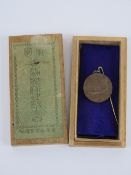 A Japanese Naval pin badge in box.