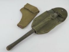 A WWII Pattern 38 holster together with a US trench tool.