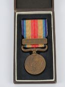 A WWII Japanese 1937-1945 China Incident war medal in box.