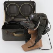 A pair of Russian PNV-57 tank crew night vision goggles with tankers head piece in transit box and