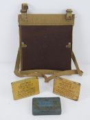 A WWII British map case dated 1944, together with three ointment Anti-gas tins,
