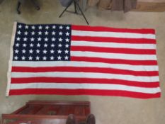 A large US flag with 48 stars measuring 5ft by 9.