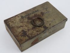 A WWII German Military tin, having stencilling and dates to the top.