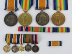 Two pairs of WWI British medals, each being War & Defence medals with ribbon,