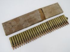 A Japanese 7.7 Woodpecker strip with 30 rounds in box.