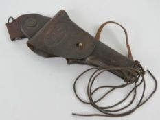 A WWII German Colt 1911 leather holster with belt attachment.