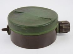 An inert Soviet PMN-1 mine, both the end caps unscrew.