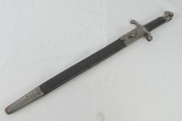 A Martini Henry sword bayonet with scabbard, bearing WD markings and the serial 12065 upon.