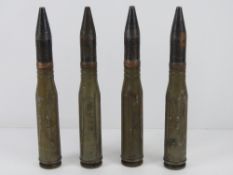 A quantity of inert Russian 23mm training rounds. Four items.