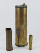 A trench art flask made from a brass shell dated 1917 together with a 30mm brass case and a 20mm