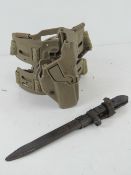 An AK47 bayonet with scabbard and a modern Glock/SIG tactical leg holster