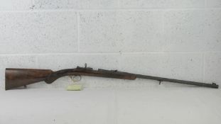 A deactivated Husqvarna .22 LR rifle bolt action rifle having moving bolt, safety, and trigger.