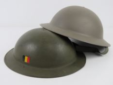 A Belgium helmet having liner and chin strap , together with a WWII allied Brodie helmet, size 56.